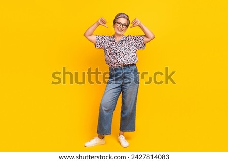 Full size photo of pretty retired female point self cheerful dressed stylish leopard print outfit isolated on yellow color background