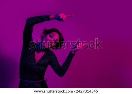 Photo portrait of pretty young girl point cheerful empty space wear trendy overall outfit isolated on neon light pink color background