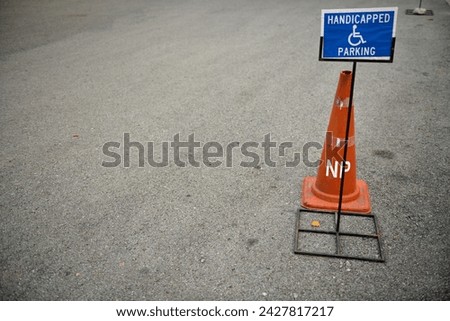 Traffic Cones and Sign for Handicapped Parking.