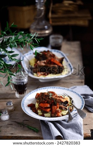 red wine cranberry braised short ribs.style rustic.selective focus Royalty-Free Stock Photo #2427820383