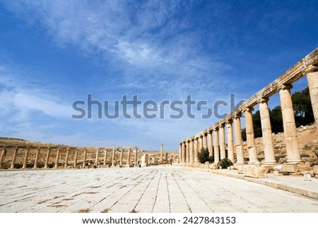 Oval plaza with colonnade and ionic columns, jerash (gerasa), a roman decapolis city, jordan, middle east Royalty-Free Stock Photo #2427843153