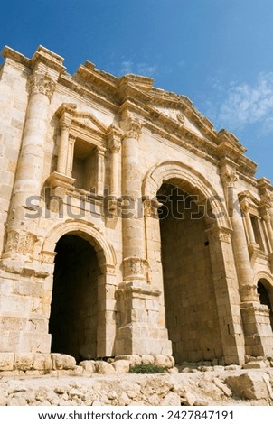 Main entrance, hadrian's arch, jerash (gerasa) a roman decapolis city, jordan, middle east Royalty-Free Stock Photo #2427847191