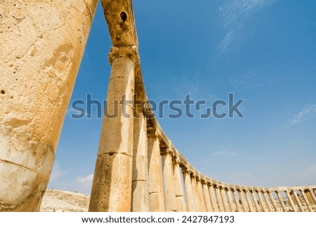 Oval plaza with colonnade and ionic columns, jerash (gerasa) a roman decapolis city, jordan, middle east Royalty-Free Stock Photo #2427847193