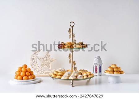  Arabic cuisine.  Maamoul with dates, pistachio   or walnuts . Traditional middle eastern sweets  for celebration  Eid Al- Fitr after Ramadan                             Royalty-Free Stock Photo #2427847829