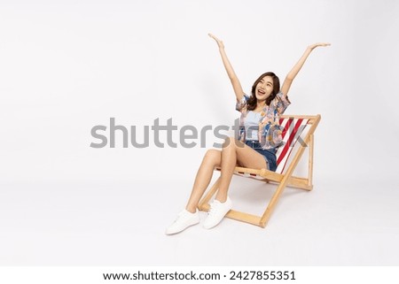 Tourists Asian woman sitting on beach chairs and look extremely happy isolated on white background