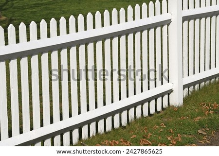 This image beautifully captures the balance between functionality and aesthetics, showcasing how a well-designed fence can enhance the overall appeal of a residence. Whether it's for landscaping ideas