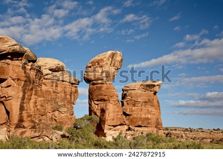 Rock formation with clouds, the needles district, canyonlands national park, utah, united states of america, north america Royalty-Free Stock Photo #2427872915