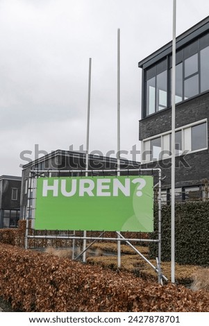Rental sign in front of modern office space buildings