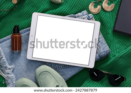Flat lay composition with modern tablet on table. Space for text