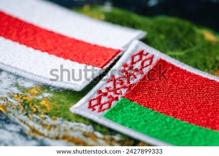 Belarus flags facing each other, Government and opposition Belarusian flag, Political and social concept Royalty-Free Stock Photo #2427899333