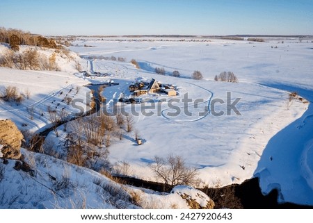 winter landscape in the vastness of the Ural Mountains in Russia, camping on the shore of an ice-free lake, a trip to Europe. High quality photo