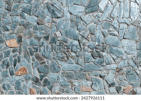Mosaic green stone wall pattern, front view, background photo texture