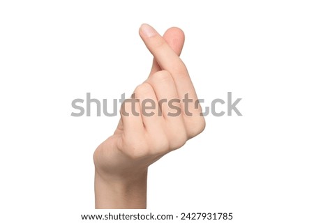 Female hand showing finger heart or mini heart gesture with the index finger and thumb come together like a snap, isolated on transparent background, png file Royalty-Free Stock Photo #2427931785