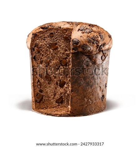 Panettone, an Italian type of sweet bread loaf, with slice cut of reviling chocolate chips inside,  usually prepared and enjoyed for Christmas and New Year. Isolated on white background.  Royalty-Free Stock Photo #2427933317