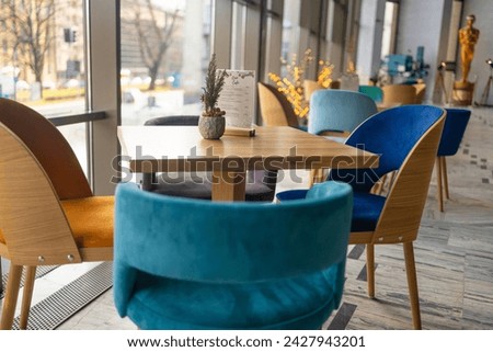 Modern cafe in loft style, black table set for coffee with brick wall. High quality photo