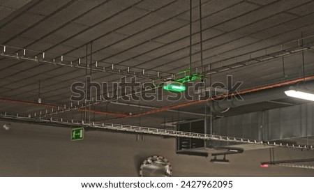Parking Lot Automated Parking Spot Occupation Ceiling Sensor Indicator with Blinking Pulsing Green LEDs
