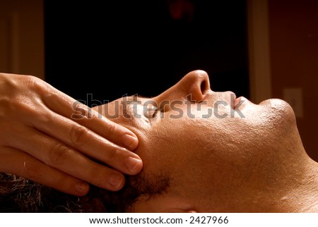 man getting a massage facial from therapist Royalty-Free Stock Photo #2427966