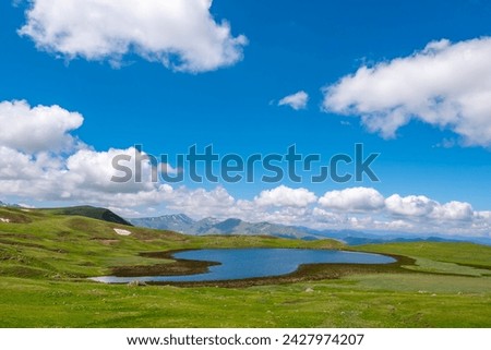 mountains lakes cloudy sky waterfall green and nature landscapes