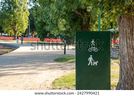 allowing dog walking and bike sign in the park