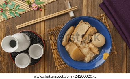 Japanese food oden and sake.Oden is a stew that contains boiled eggs, fried tofu, konjac, daikon radish and fish cakes.