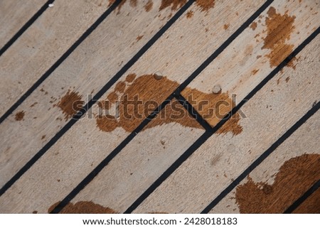 Exterior photo visual view of wet foot prints on a wood floor ground during summer on a boat or wooden platform near the sea or ocean during hot heat summer time with nice holiday weather