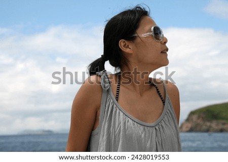Exterior portrait photo visual view of a beautiful beauty woman on a boat having fun happy moment in a relaxing day during summer nice weather near the sea ocean outdoor and alone by herself