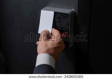 A man opens the door with a card. Modern electronic lock. Keyless Entry