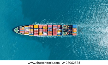 top view Cargo Container ship in the ocean ship carrying container and running for import export concept technology freight shipping by ship