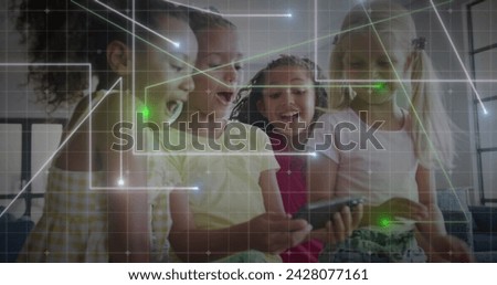 Image of glowing network over multiracial schoolgirls using tablet at break time. Communication, technology, friendship, school, education, childhood and learning, digitally generated image.