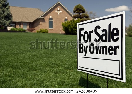 For Sale By Owner Sign In Front Of Nice Home
