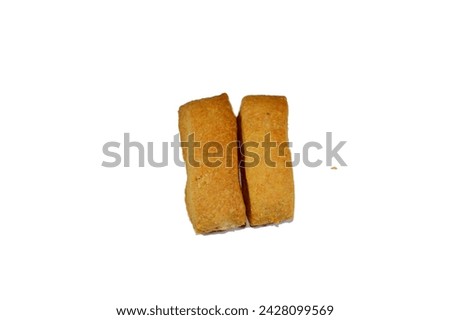 Plain Menen bakery, oriental crackers and cookies, usually baked plain or stuffed with tamr, Ajwa or dates, Arabic Egyptian oriental cuisine of cookies, consumed as a snack with a drink like tea Royalty-Free Stock Photo #2428099569