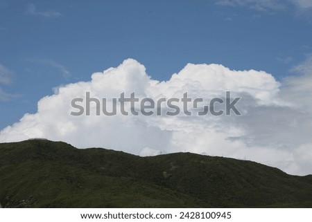 Exterior photo visual view of a amazing beautiful landscape of nature with jhills mountains forest clean white clouds and fresh blue sky during summer time with nice sunny weather