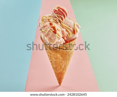 Scrumptious strawberry ice cream cone isolated on pink background