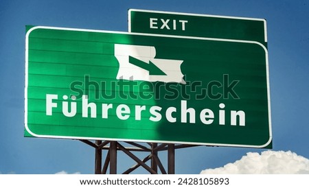 The picture shows a signpost and a sign that points in the direction of a driver's license in German.