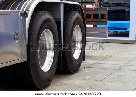 Close-up of tires of large industrial construction excavation equipment