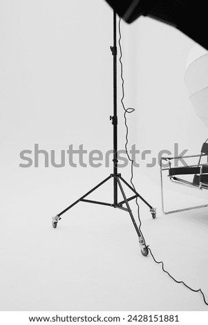 Photo Studio Space with Lighting. Flash Light Equipment on White Cyclorama Background. Fashion Shoot.