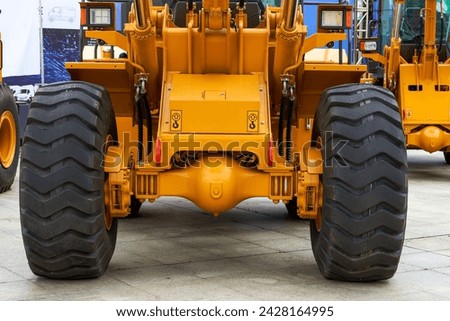 Close-up of tires of large industrial construction excavation equipment