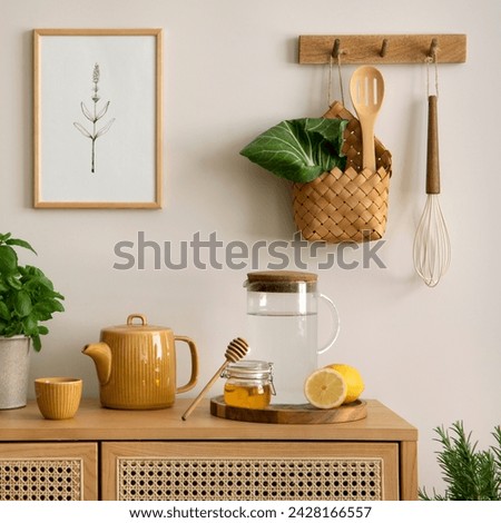 Creative composition of kitchen space with mock up poster frame, rattan commode, pitcher, herbs, vegetables, lemon, banana peach, food and kitchen accessories. Home decor. Template. 