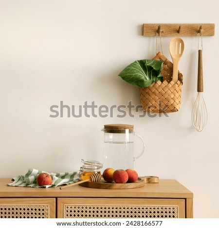 Interior design of of kitchen space with rattan commode, boho chair, ladder,  cutting board, herbs, vegetables, bread, eggs, pitcher, food and kitchen accessories. Home decor.  Template. 