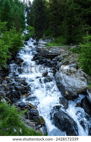 Alpine panorama with waterfall during the summer in the South Tyrol