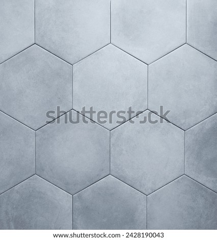 Background of gray hexagon shaped ceramic tiles. Trendy empty backdrop for displaying products or advertising. Top view and copy space.