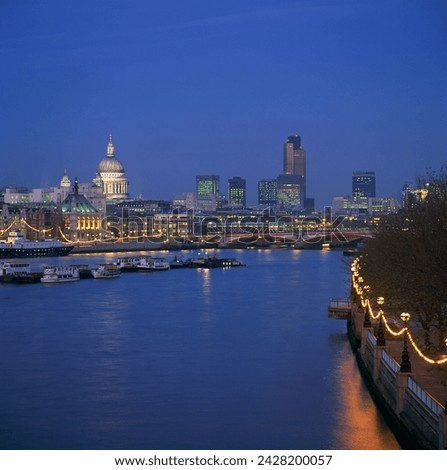 City skyline, including st. paul's cathedral, the natwest tower and southwark bridge, from across the thames at dusk, london, england, united kingdom, europe