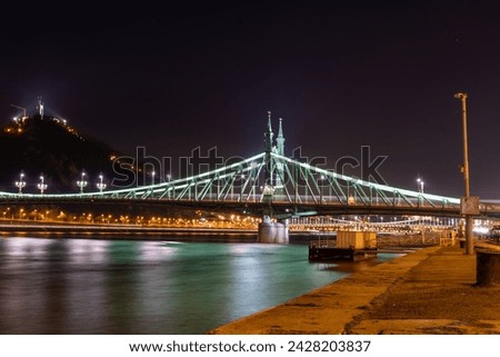 Budapest, Hungary: February 17, 2024: Liberty bridge at night. Citadella on the background. Royalty-Free Stock Photo #2428203837
