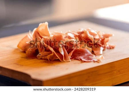 delicious prosciutto close-up on wooden board stock photo
