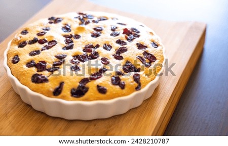 delicious pear and cranberry desserts close-up on wooden board 
