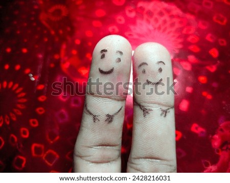 Painted finger love concept happy loving couple staying together, smiley on red background valentine's day theme hd ultra hd hi-res stock image photo picture selective focus on horizontal background 