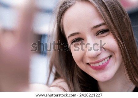 Portrait of young beautiful caucasian female use smartphone selfie say hi over white background. Happy woman online influencer blogger. Education technology connected people girl lifestyle concept