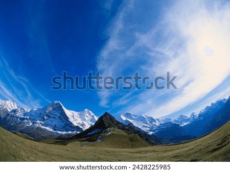 Fish eye lens of mt eiger, mt jungfrau and mt monch, bernese oberland, switzerland Royalty-Free Stock Photo #2428225985