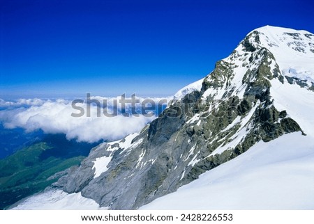 Monch (13449 ft) mountain, bernese oberland, swiss alps, switzerland, europe Royalty-Free Stock Photo #2428226553