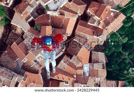Roquebrune-Cap-Martin, Provence-Alpes-Côte d’Azur, France, 08 20 1989, man in Paraglider flying above 